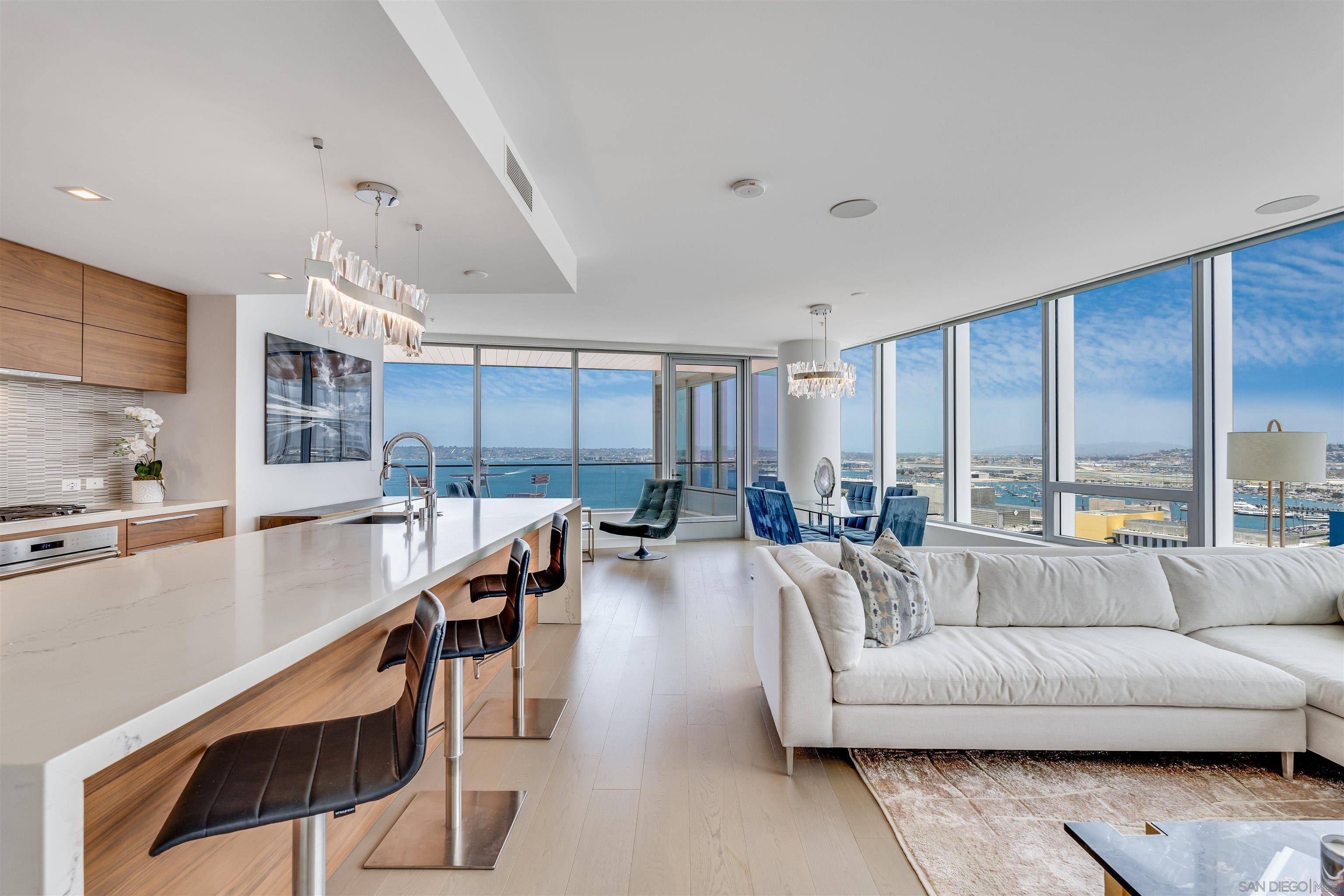 888 West E Street, Unit 2401 San Diego, CA 92101 - Photo 1 of 65 a living room with furniture and a large window