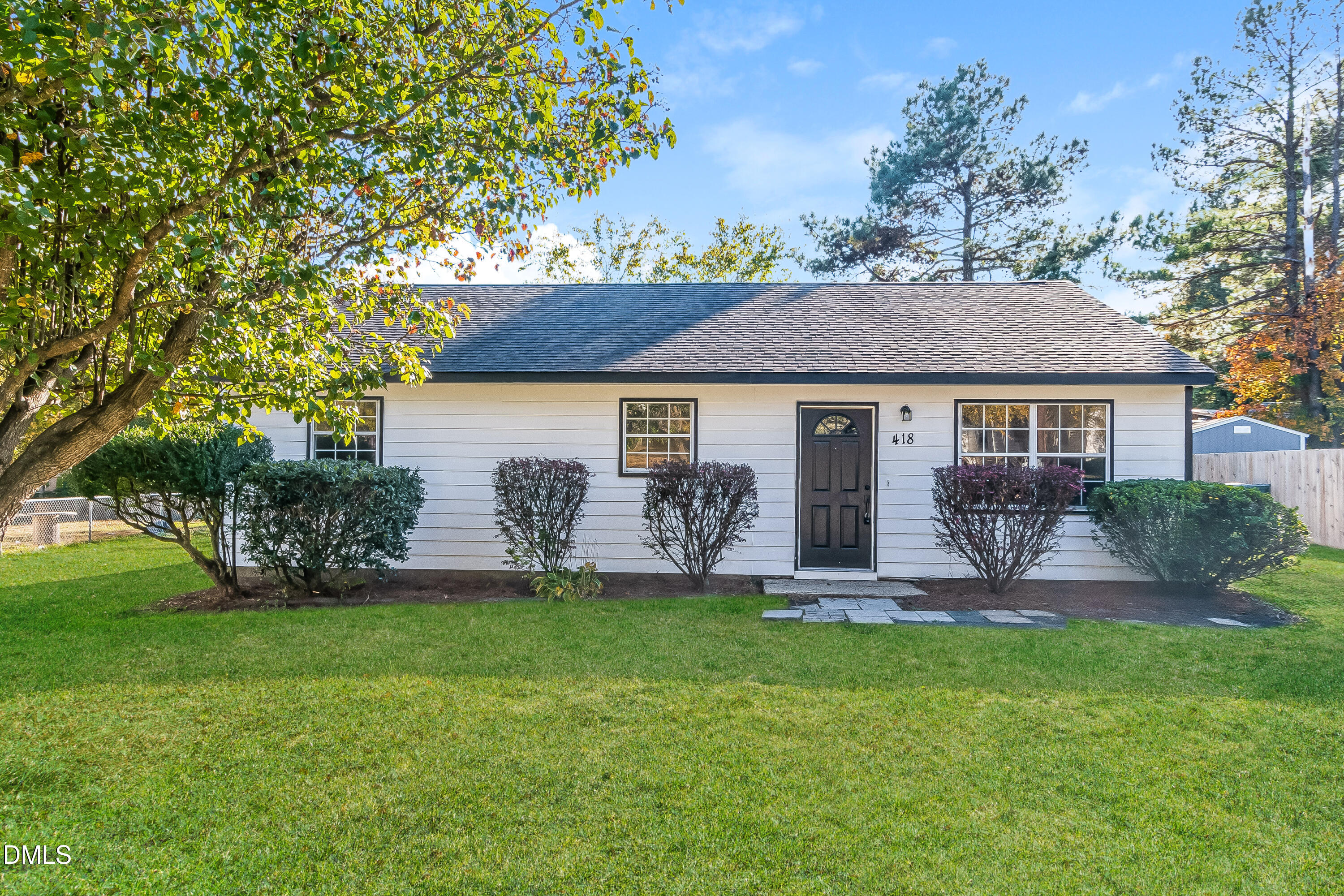 418 Craven Street Durham, NC 27704 - Photo 1 of 14 a front view of a house with a yard and garage