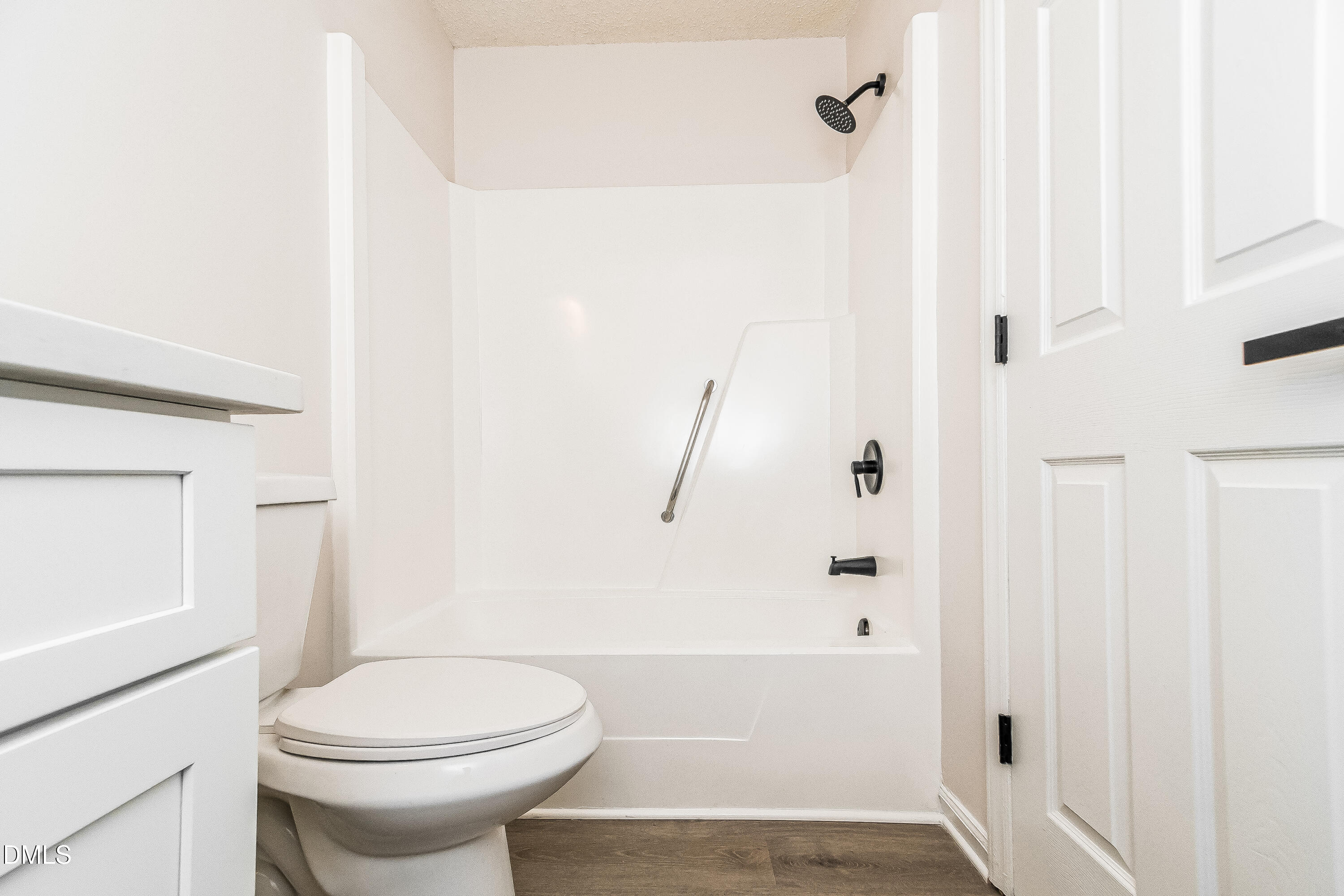 418 Craven Street Durham, NC 27704 - Photo 12 of 14 a bathroom with a toilet and a shower