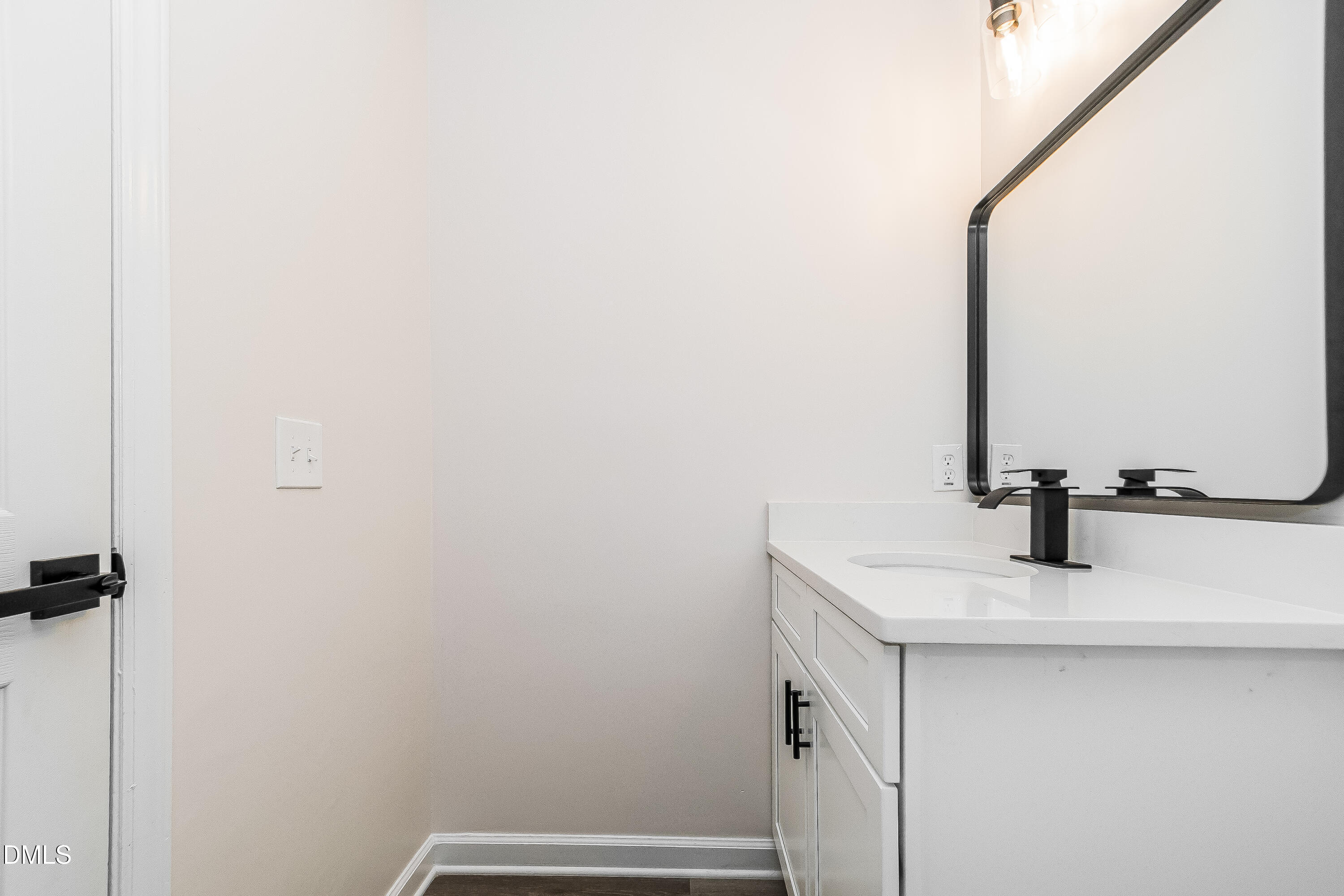 418 Craven Street Durham, NC 27704 - Photo 13 of 14 a bathroom with a sink and a mirror