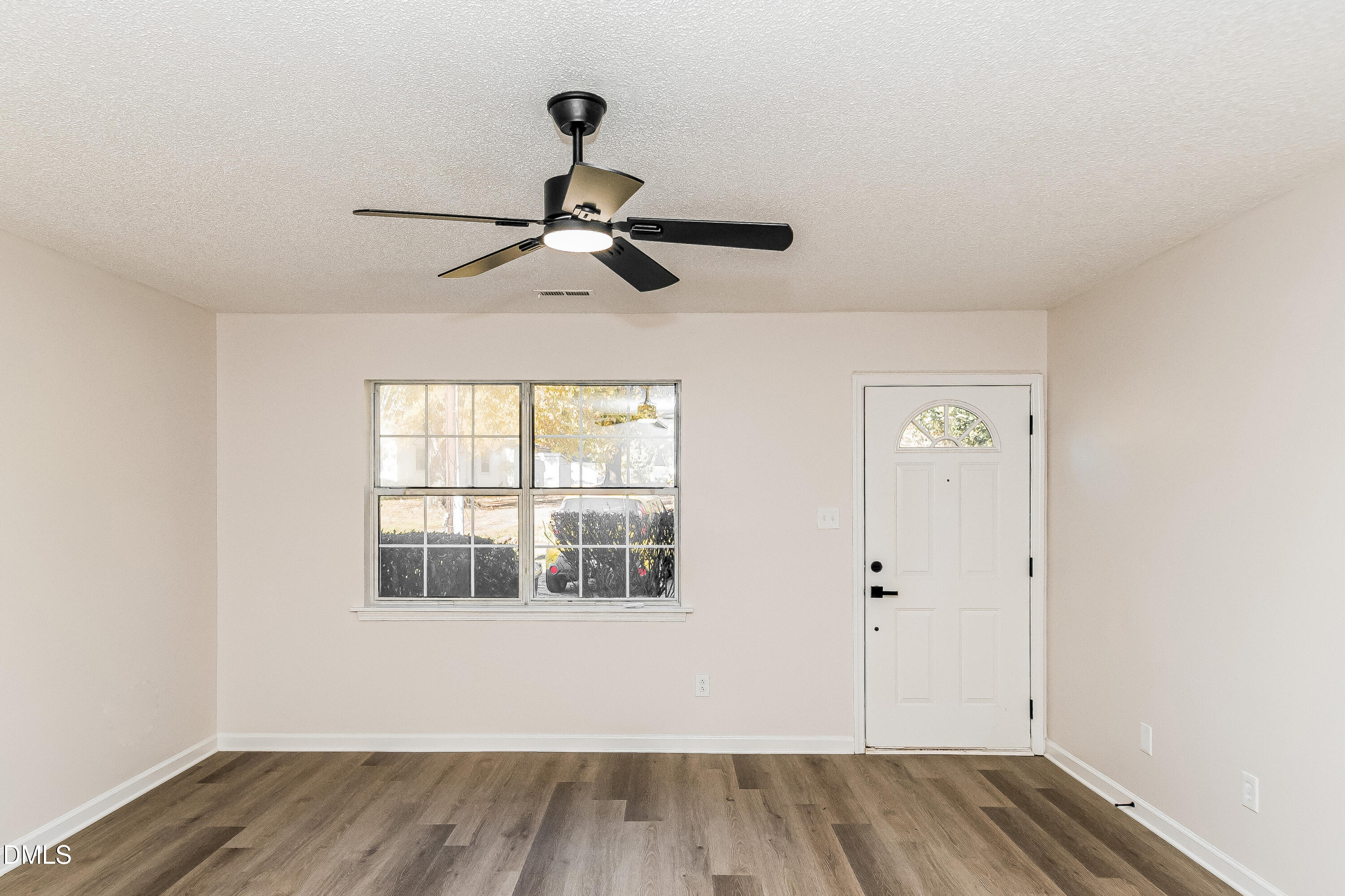 418 Craven Street Durham, NC 27704 - Photo 2 of 14 wooden floor in an empty room with a window