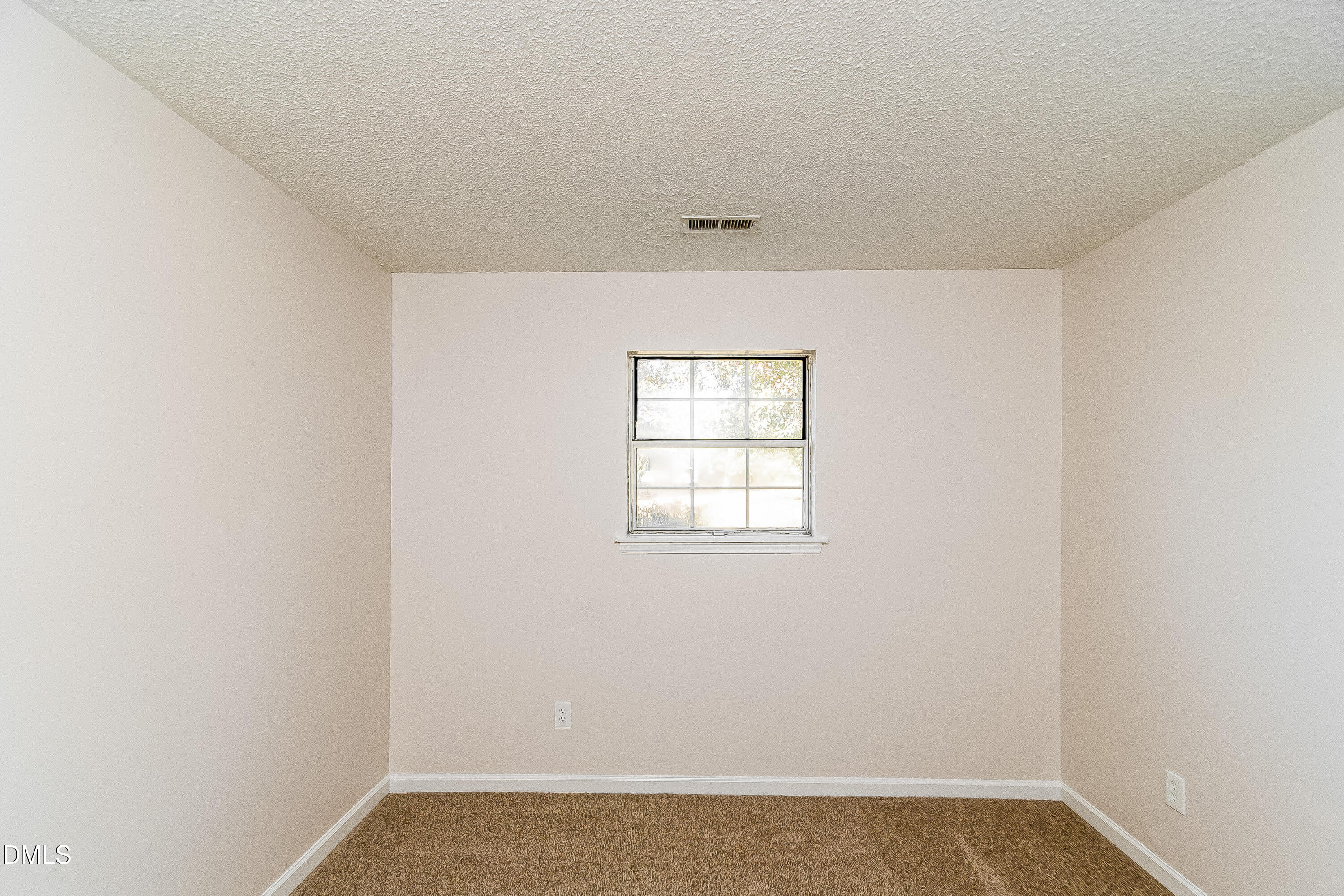 418 Craven Street Durham, NC 27704 - Photo 7 of 14 an empty room with a window