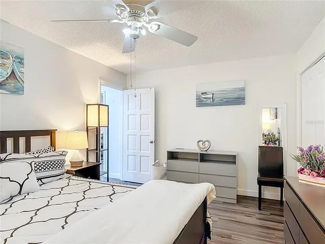 a bedroom with a bed and a table in it