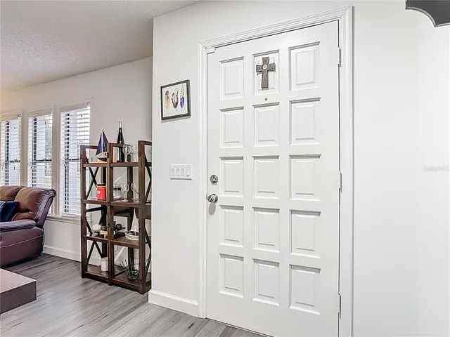 a view of a livingroom with furniture and hardwood floor