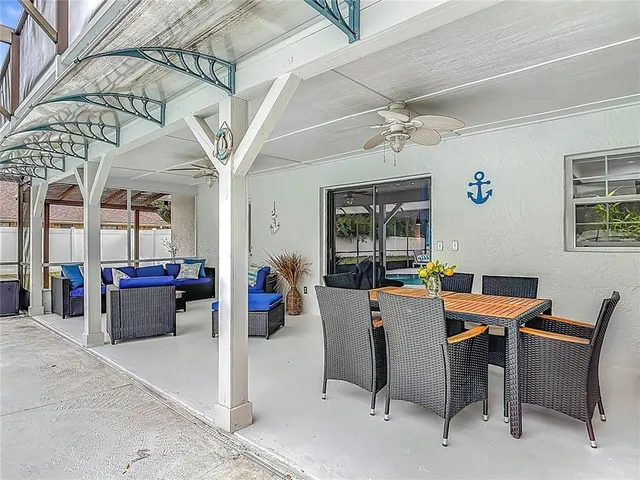 a dining room with a table and chairs