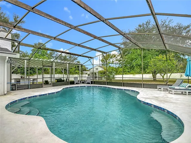 a view of a swimming pool with a patio