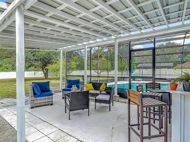 a building outdoor seating with furniture and garden