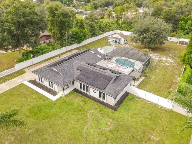 a view of a swimming pool with a yard