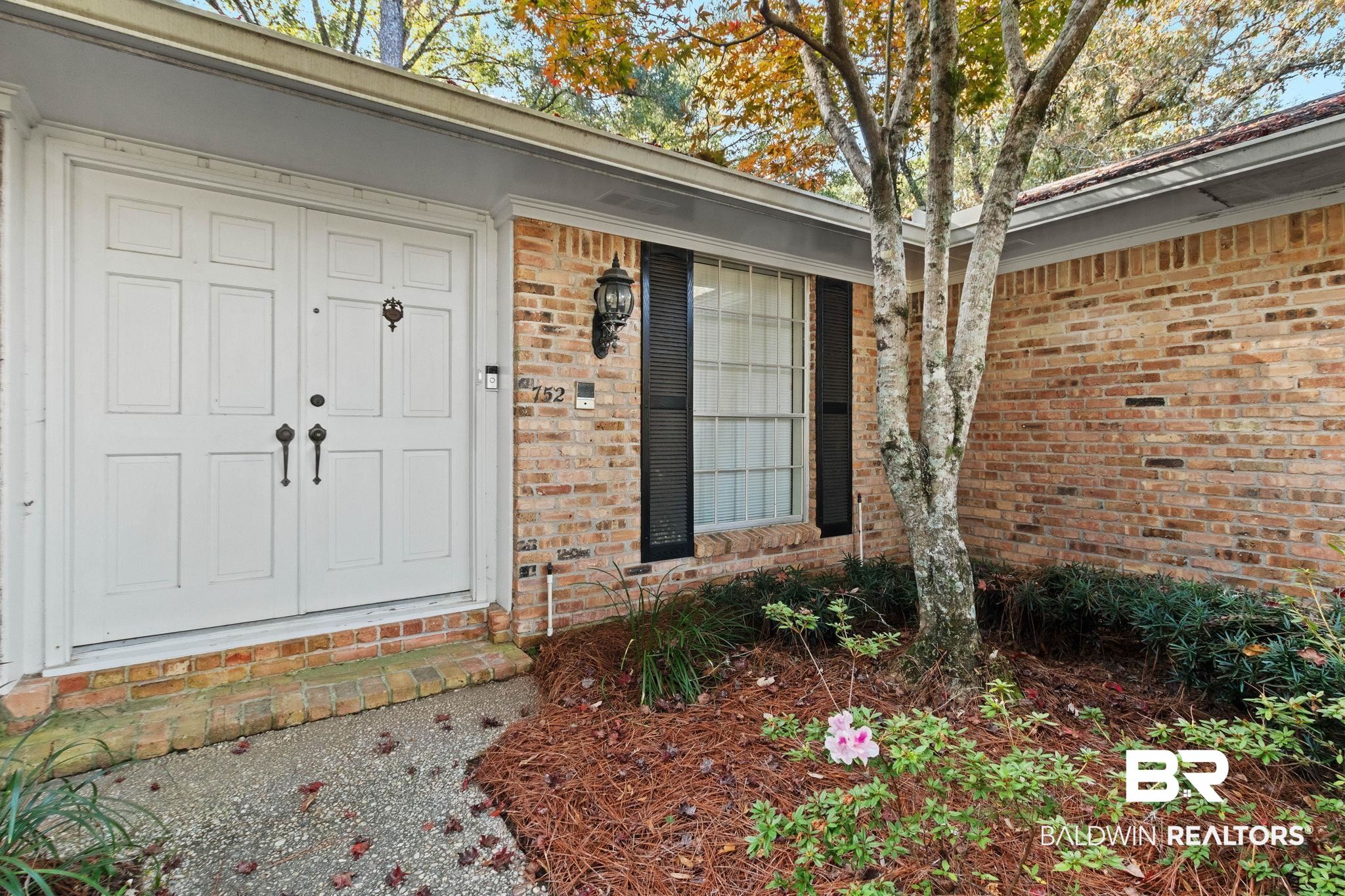 752 Evergreen Street Fairhope, AL 36532 - Photo 82 of 100 Property entrance with brick siding