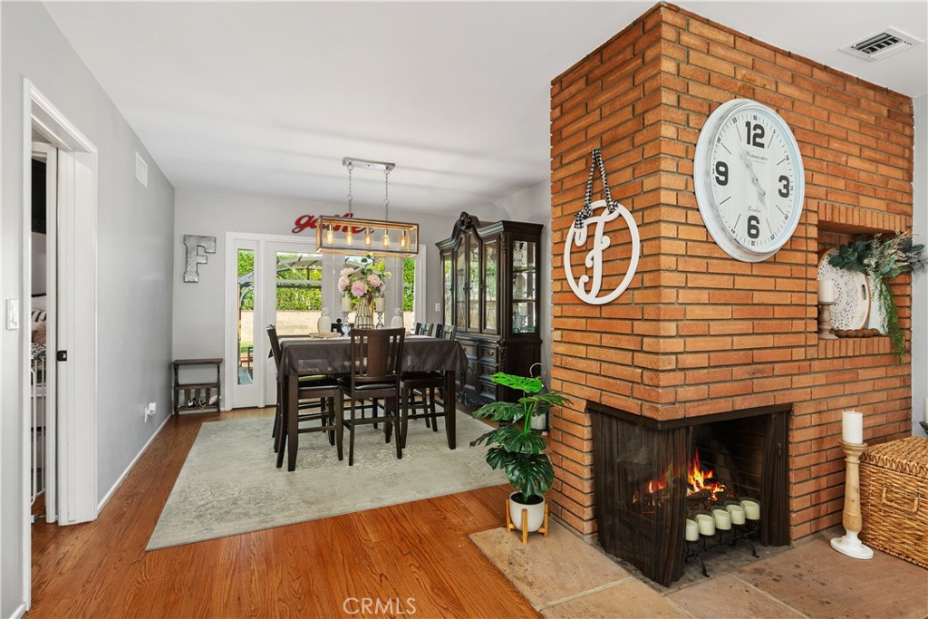206 Melrose Avenue Monrovia, CA 91016 - Photo 12 of 35 a dining room with furniture entryway and wooden floor