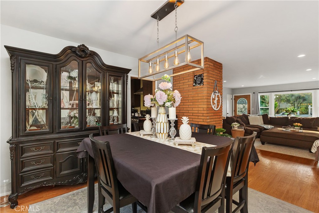 206 Melrose Avenue Monrovia, CA 91016 - Photo 13 of 35 a view of a dining room with furniture window and wooden floor