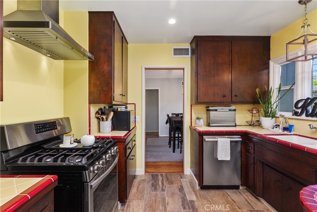 206 Melrose Avenue Monrovia, CA 91016 - Photo 18 of 35 a kitchen with a stove and a refrigerator