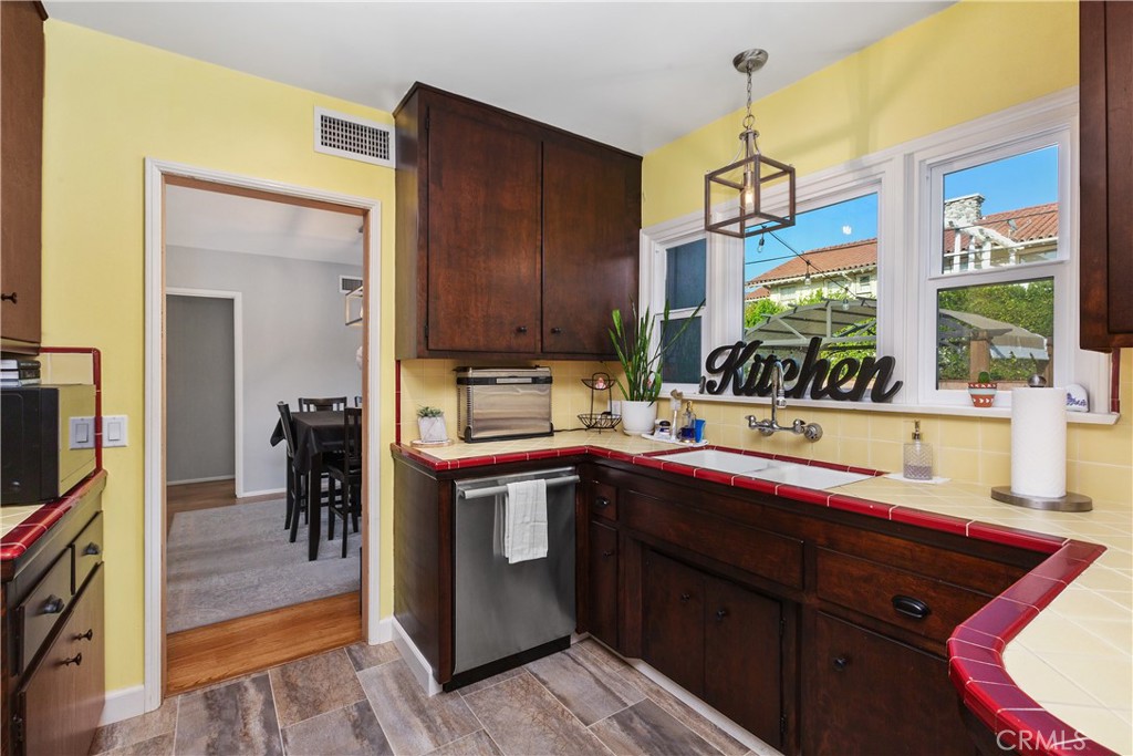 206 Melrose Avenue Monrovia, CA 91016 - Photo 19 of 35 a kitchen with a sink and cabinets