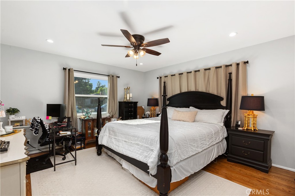 206 Melrose Avenue Monrovia, CA 91016 - Photo 24 of 35 a bedroom with a bed and wooden floor