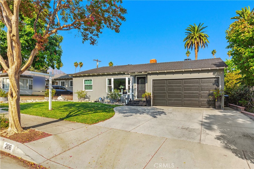 206 Melrose Avenue Monrovia, CA 91016 - Photo 4 of 35 a front view of a house with garden and trees