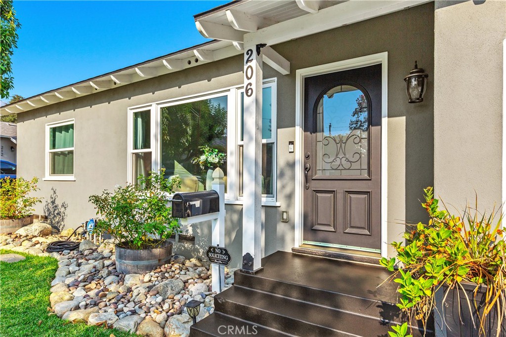 206 Melrose Avenue Monrovia, CA 91016 - Photo 5 of 35 a front view of a house with a porch