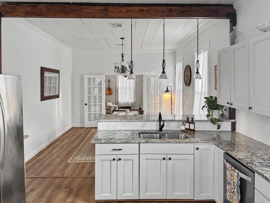 1517 Cumberland Avenue Waco, TX 76708 - Photo 12 of 30 a bathroom with a granite countertop sink and a mirror