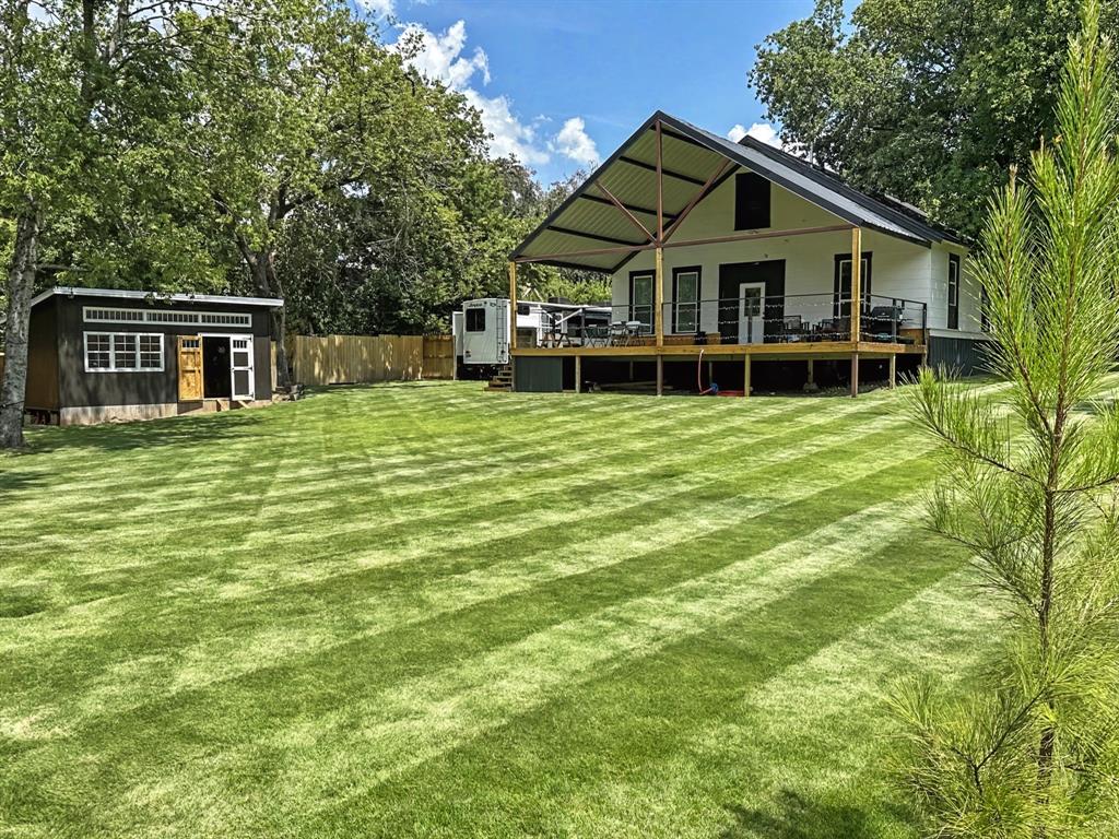 1517 Cumberland Avenue Waco, TX 76708 - Photo 2 of 30 a house with a big yard and large trees