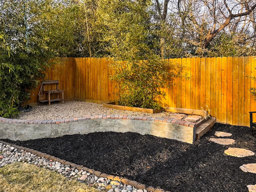 1517 Cumberland Avenue Waco, TX 76708 - Photo 27 of 30 a view of a backyard with chairs and a table