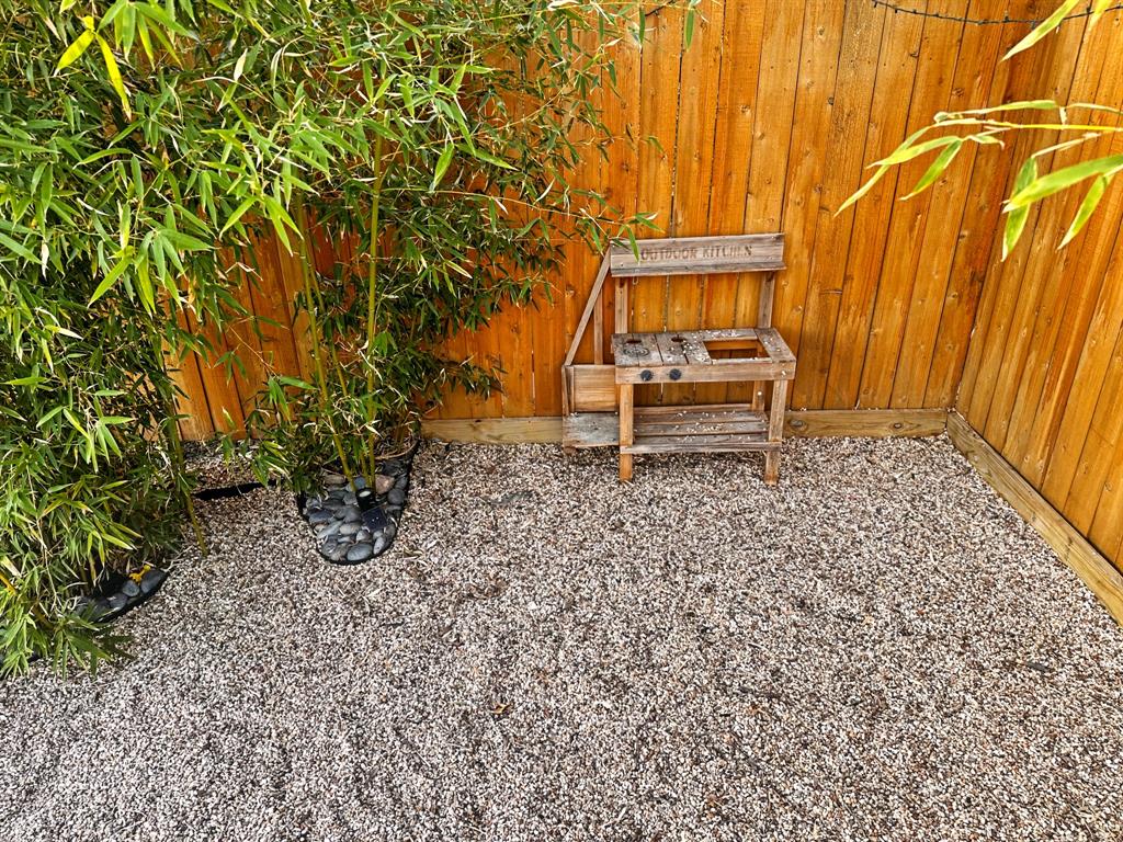 1517 Cumberland Avenue Waco, TX 76708 - Photo 28 of 30 a bench sitting in the backyard of a house