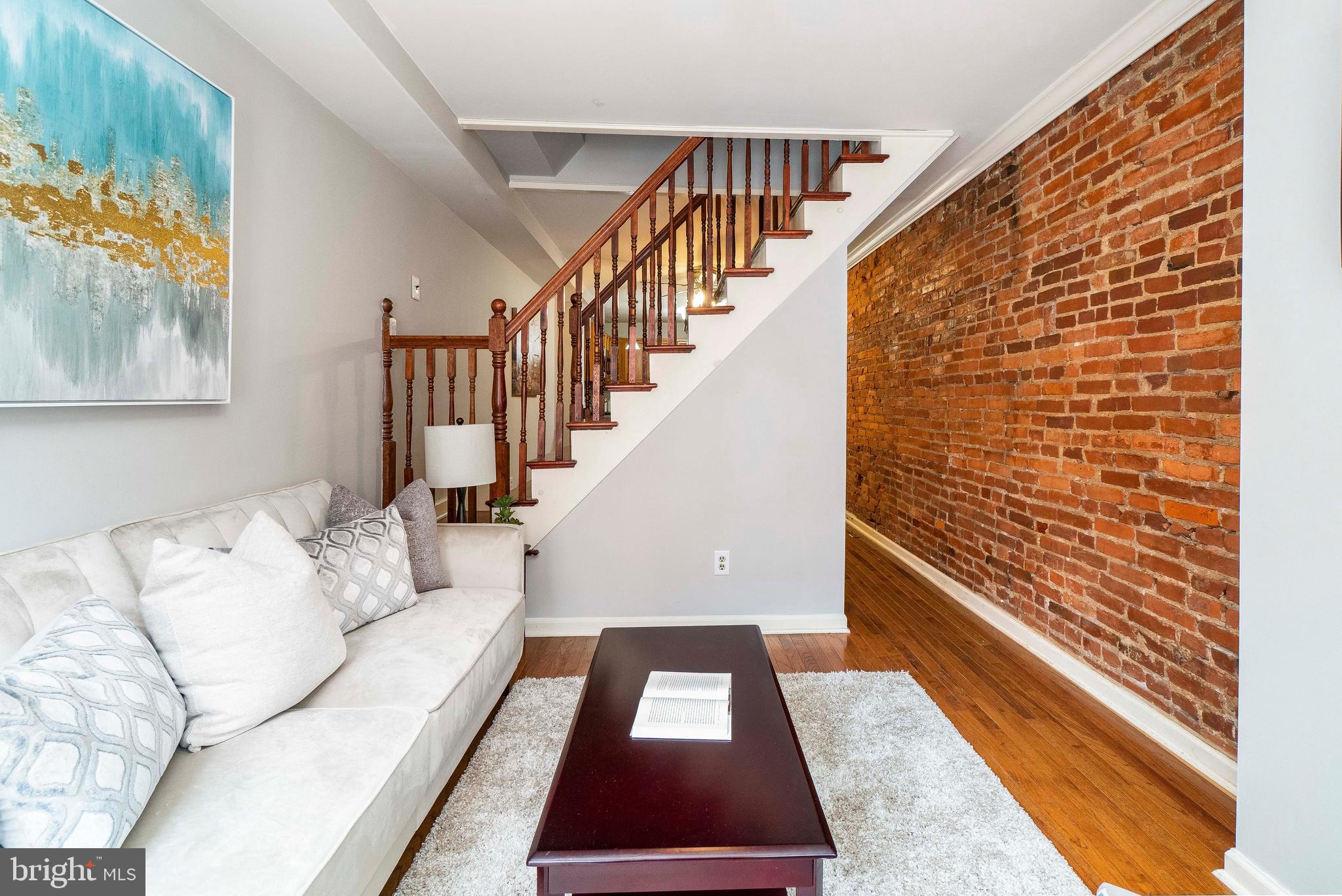 1434 Cooksie Street Baltimore, MD 21230 - Photo 3 of 30 Living Room With Exposed Brick