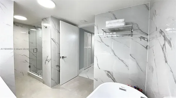 a bathroom with a shower and toilet