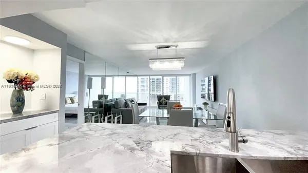 a view of a dining room with furniture window and outside view