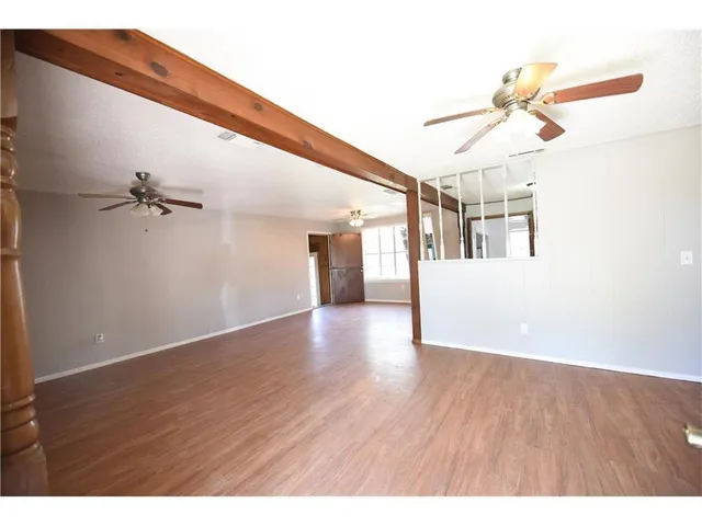 a view of an entryway with wooden floor