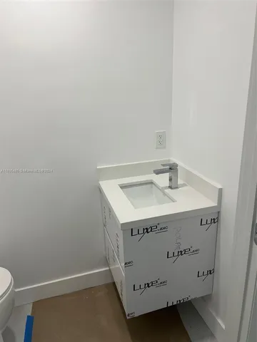 a bathroom with a toilet and a sink