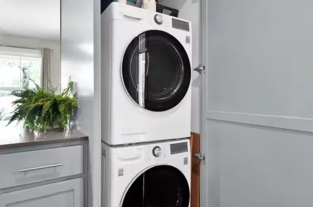 a bedroom with a large bed and a flat screen tv