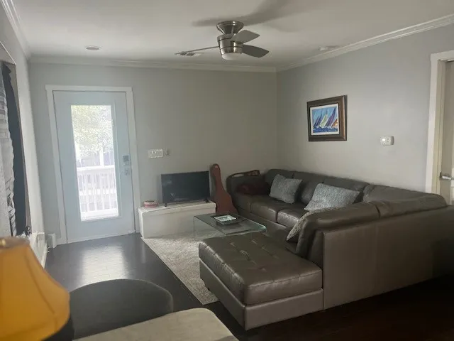 a kitchen with kitchen island granite countertop a sink cabinets and stainless steel appliances
