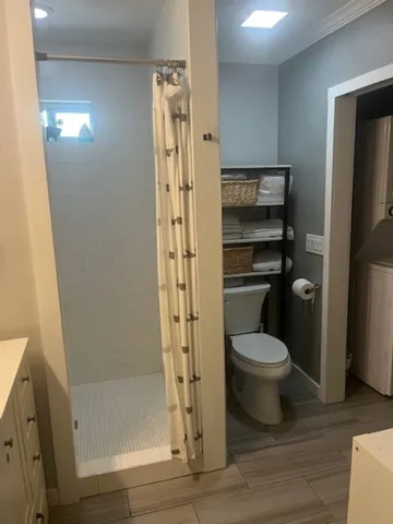 a bathroom with a toilet and a vanity