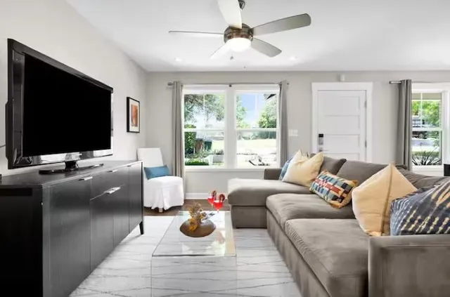 a living room with furniture and a flat screen tv