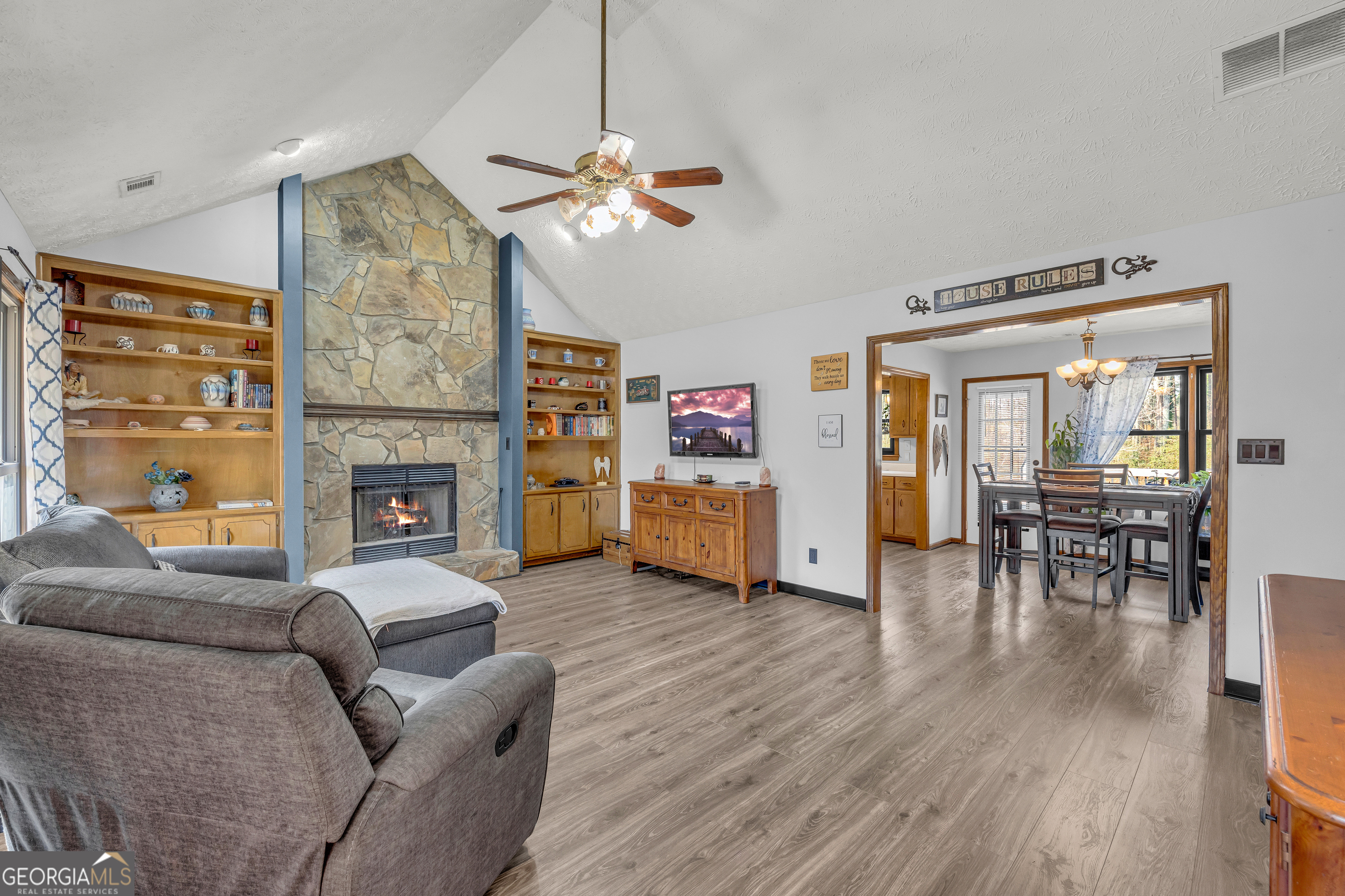 233 Kennedy Sells Road Northwest Auburn, GA 30011 - Photo 11 of 52 a living room with furniture and a fireplace