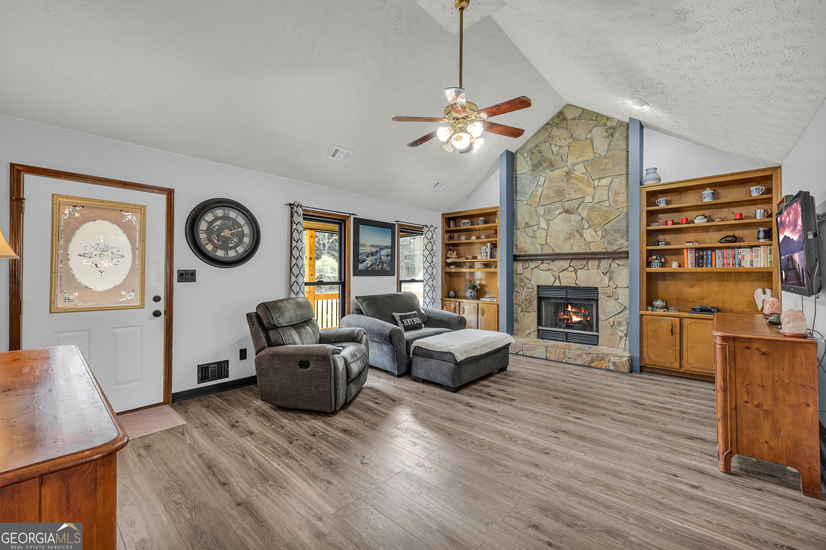 233 Kennedy Sells Road Northwest Auburn, GA 30011 - Photo 12 of 52 a living room with furniture and a fireplace