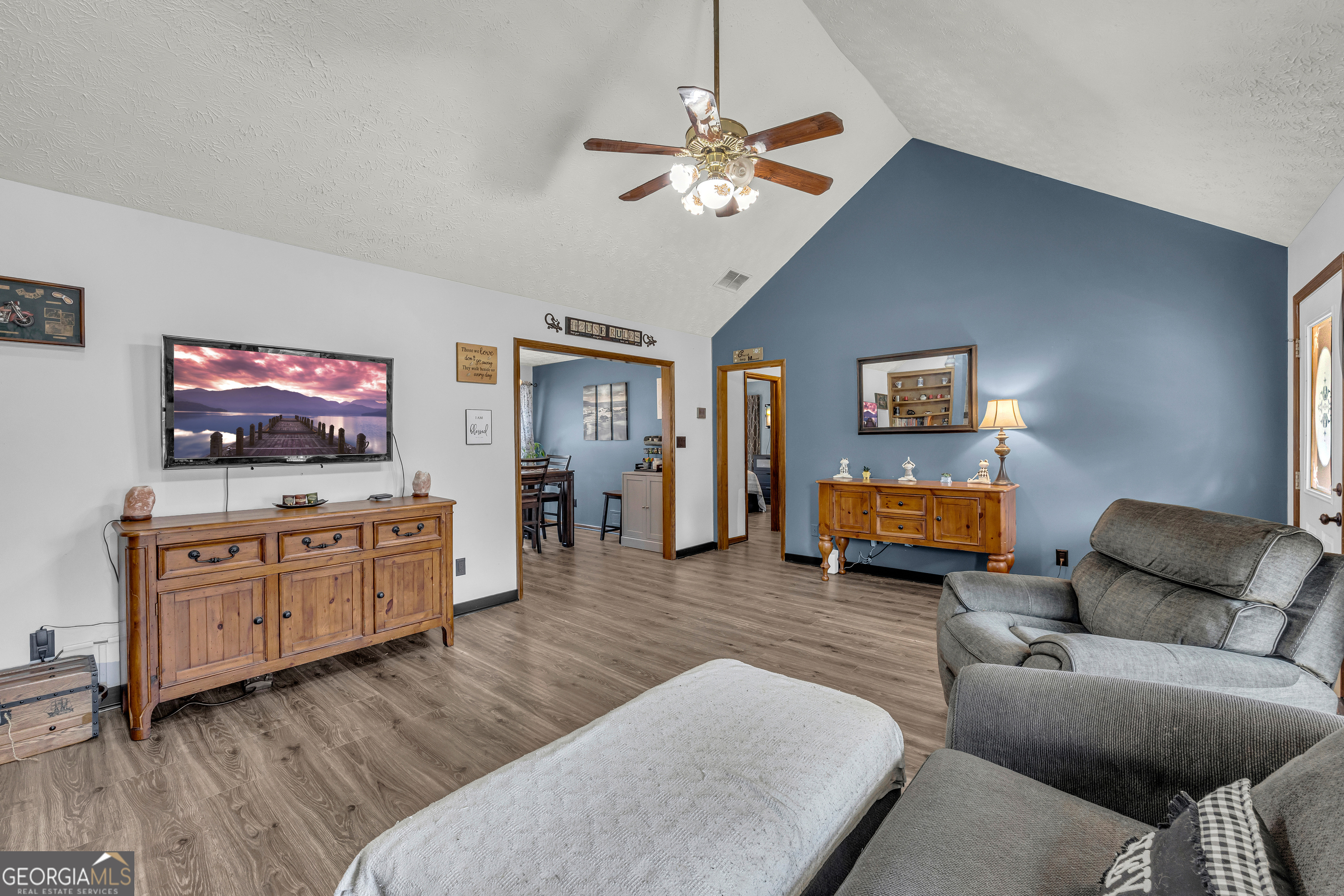 233 Kennedy Sells Road Northwest Auburn, GA 30011 - Photo 14 of 52 a living room with furniture and a flat screen tv