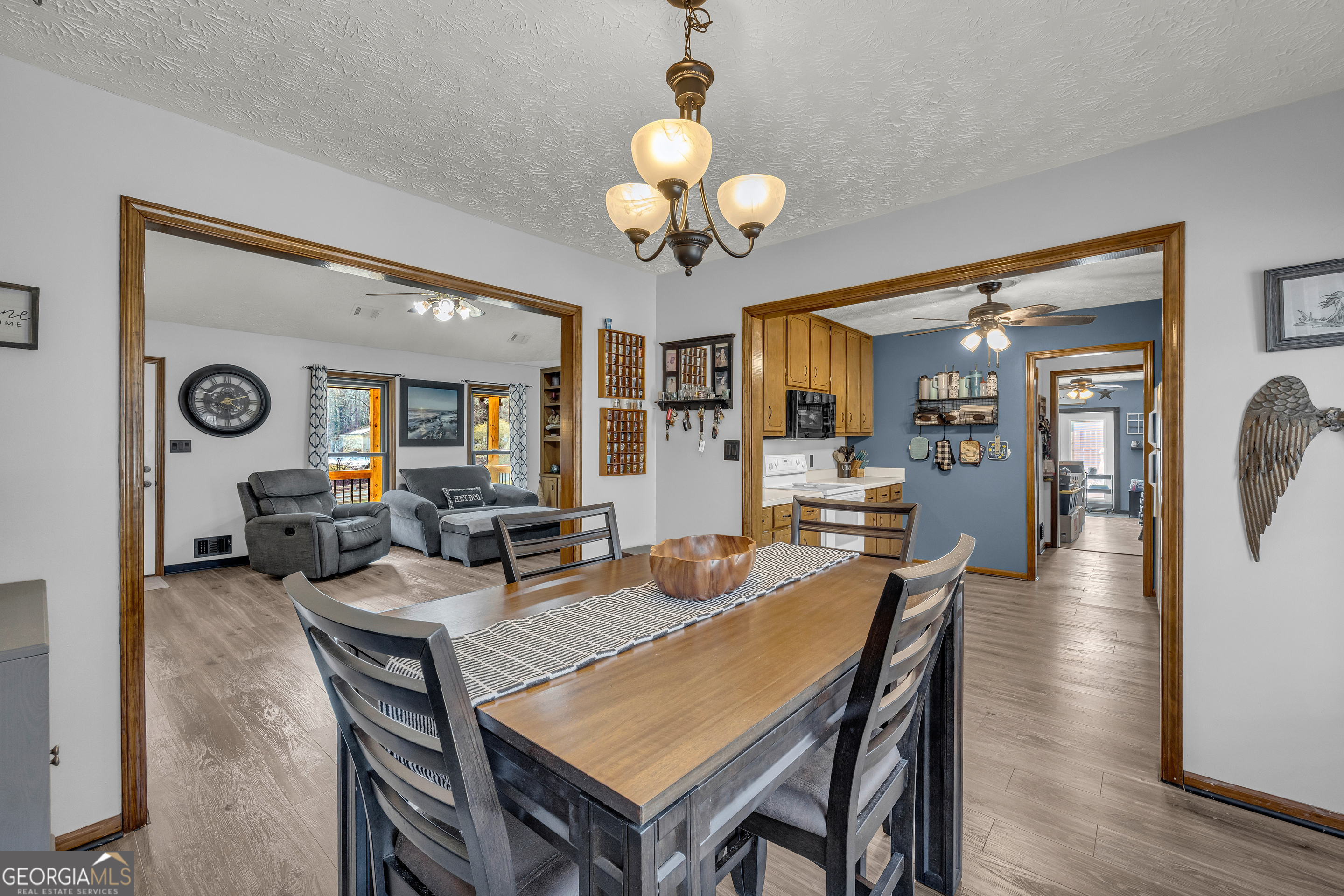233 Kennedy Sells Road Northwest Auburn, GA 30011 - Photo 19 of 52 a view of a dining room with furniture and wooden floor