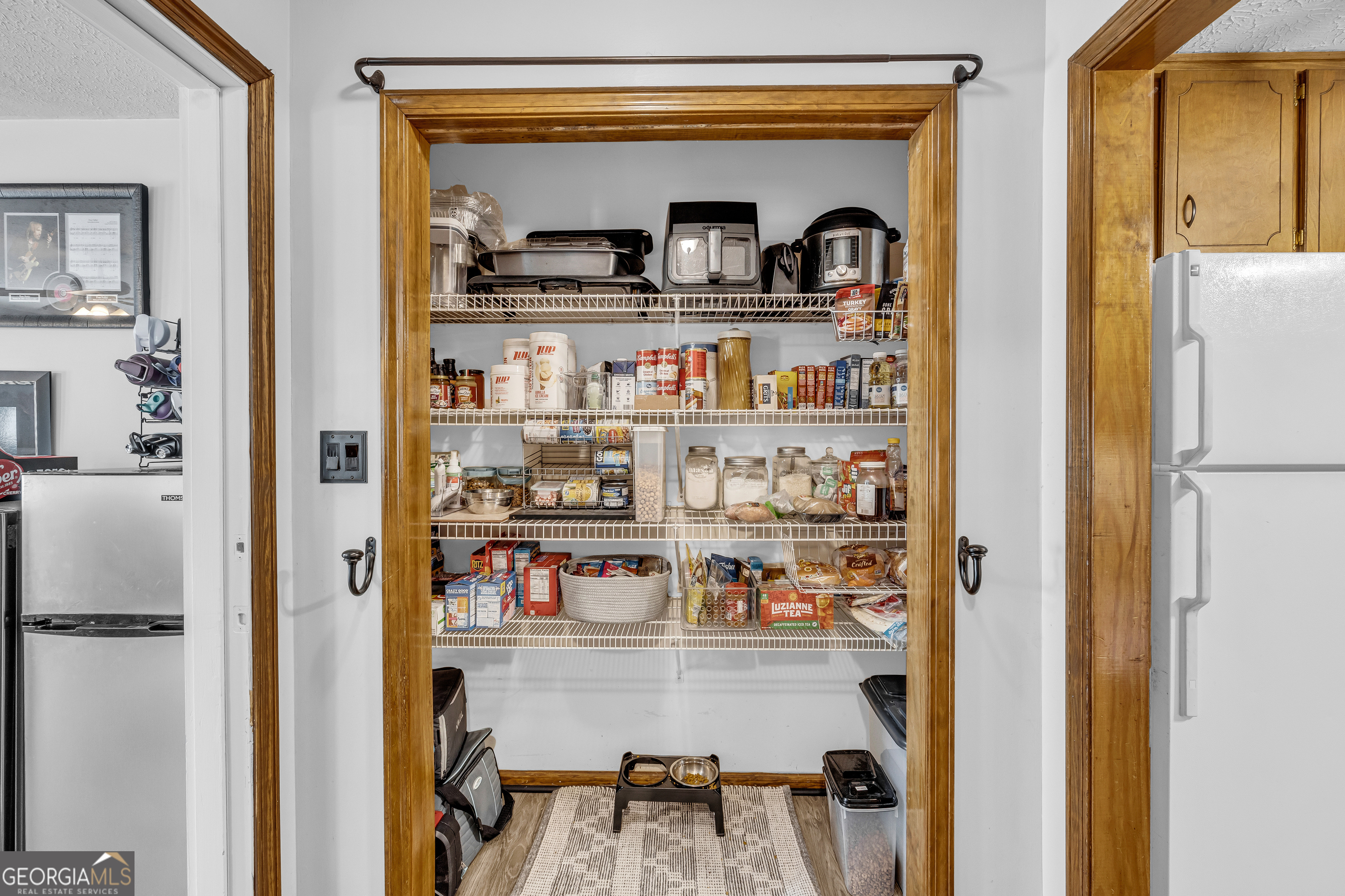 233 Kennedy Sells Road Northwest Auburn, GA 30011 - Photo 25 of 52 a shelf with books and knick knacks on it