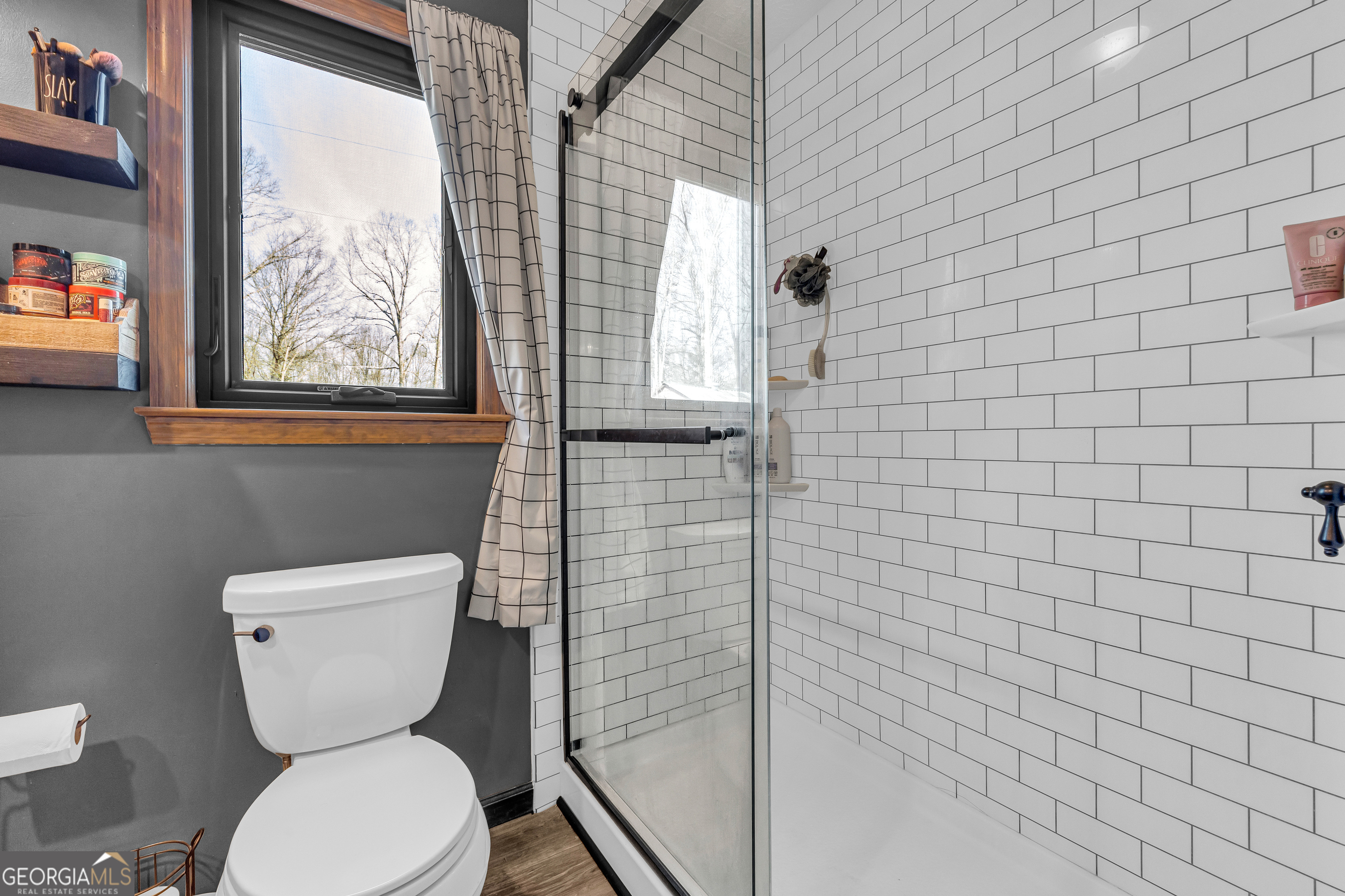 233 Kennedy Sells Road Northwest Auburn, GA 30011 - Photo 31 of 52 a bathroom with a toilet and a shower