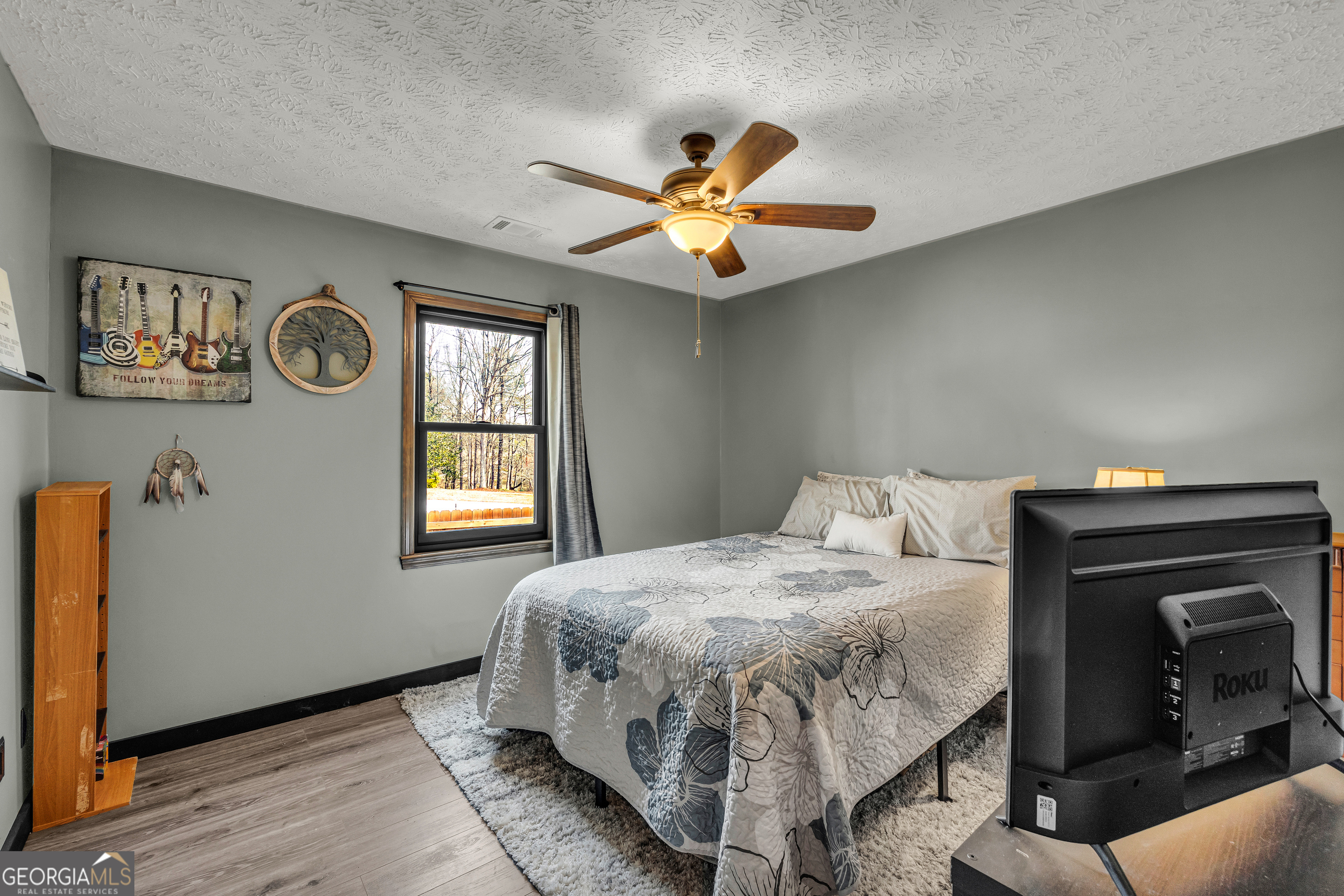 233 Kennedy Sells Road Northwest Auburn, GA 30011 - Photo 34 of 52 a bedroom with a bed and a window