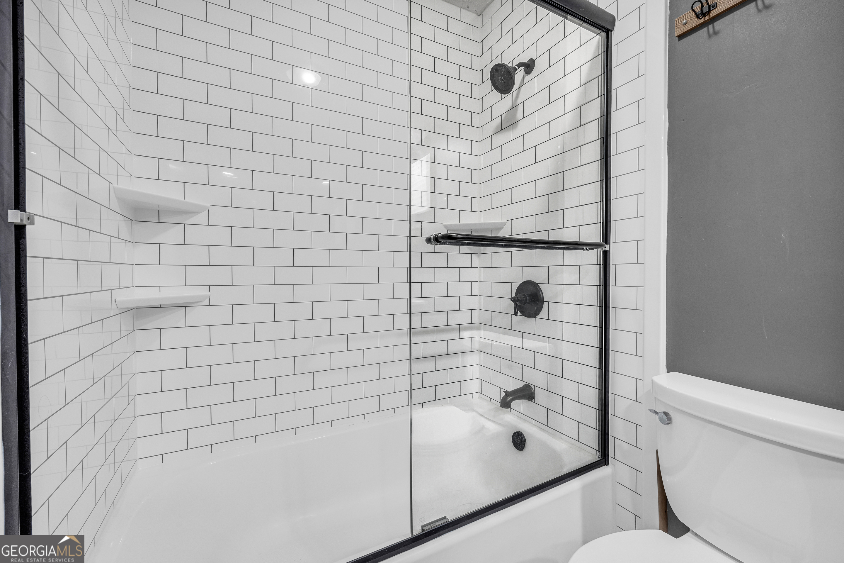 233 Kennedy Sells Road Northwest Auburn, GA 30011 - Photo 36 of 52 a bathroom with a shower and a toilet