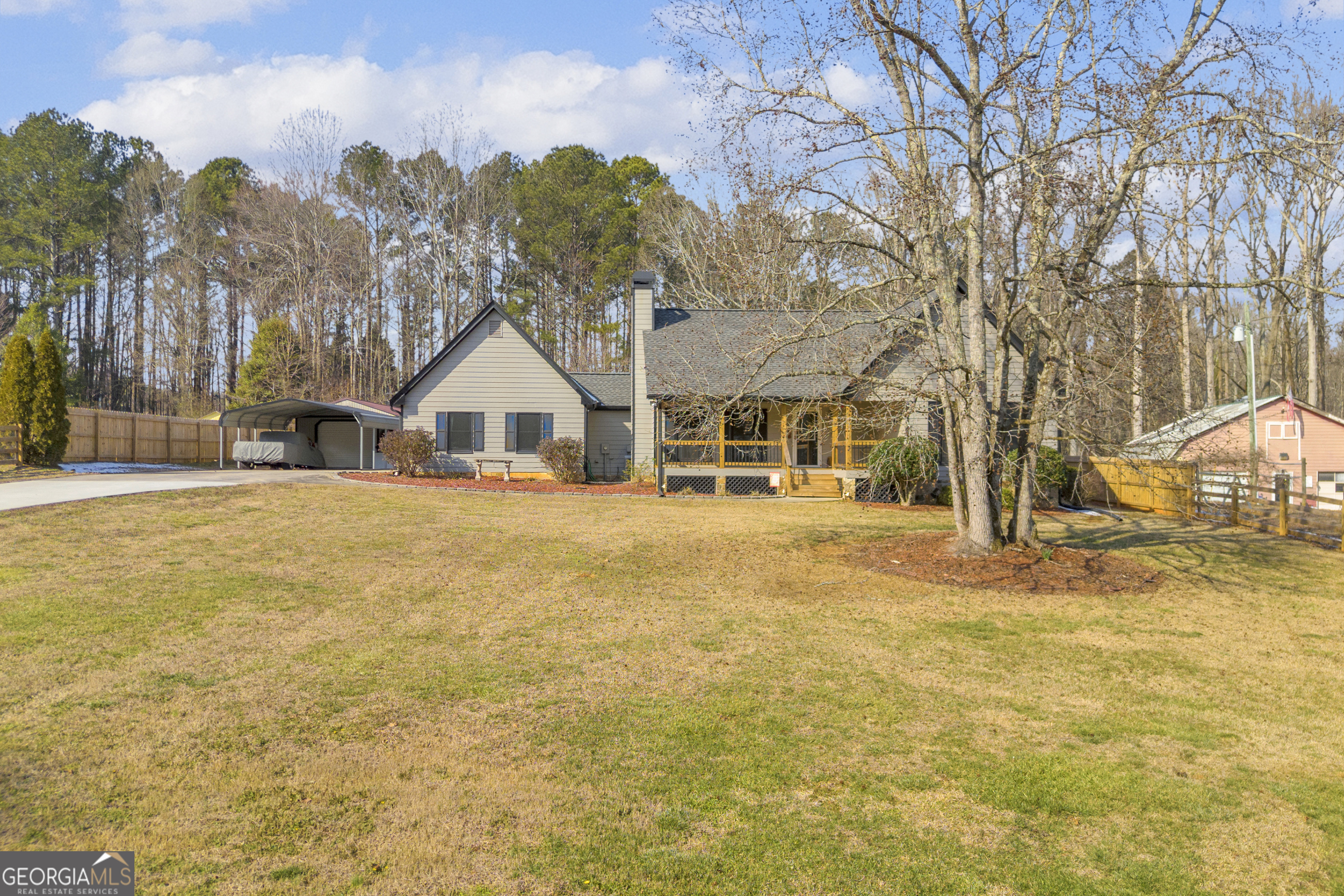 233 Kennedy Sells Road Northwest Auburn, GA 30011 - Photo 4 of 52 a house with trees in front of it