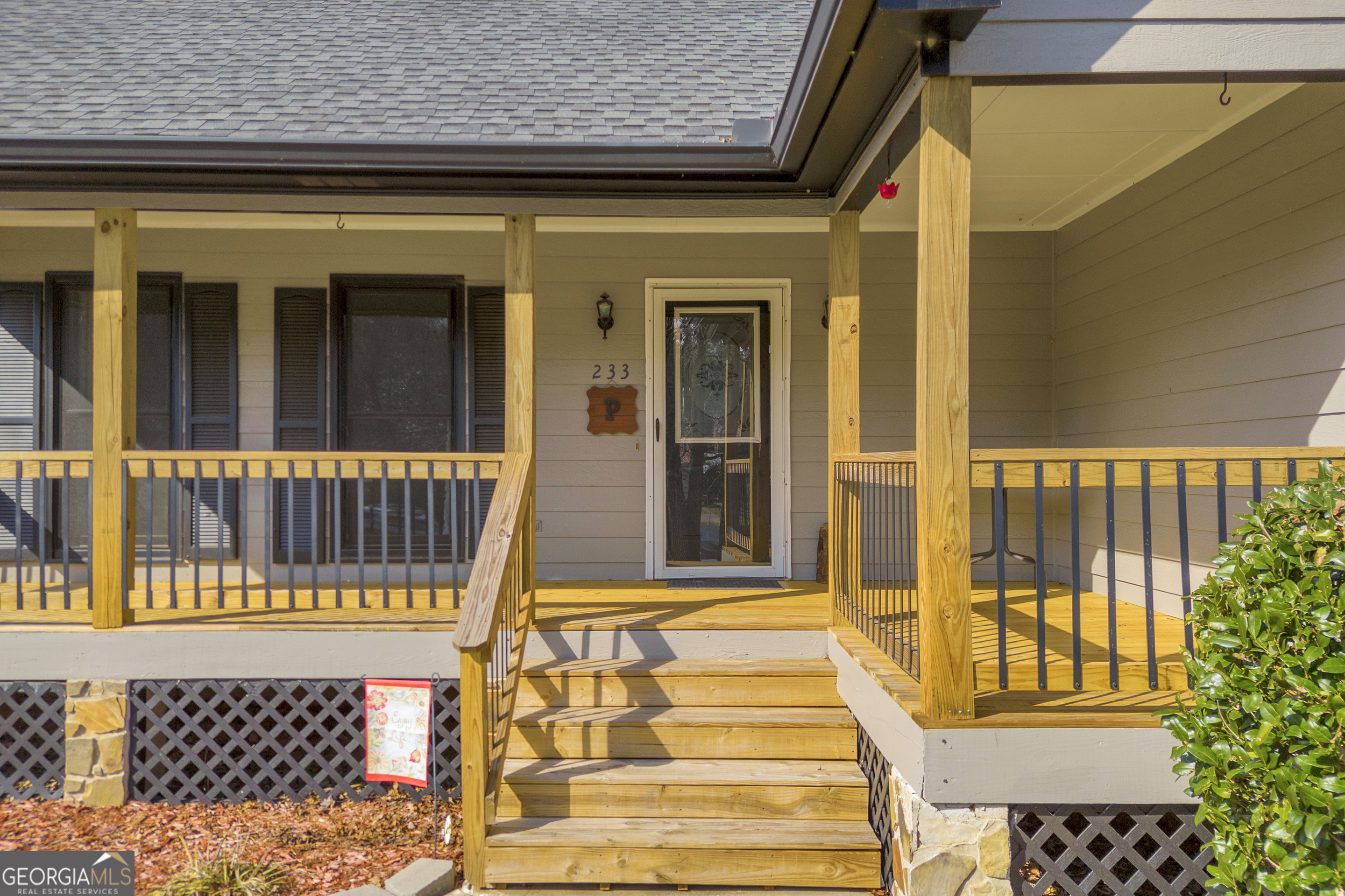 233 Kennedy Sells Road Northwest Auburn, GA 30011 - Photo 6 of 52 a view of a brick house with large windows