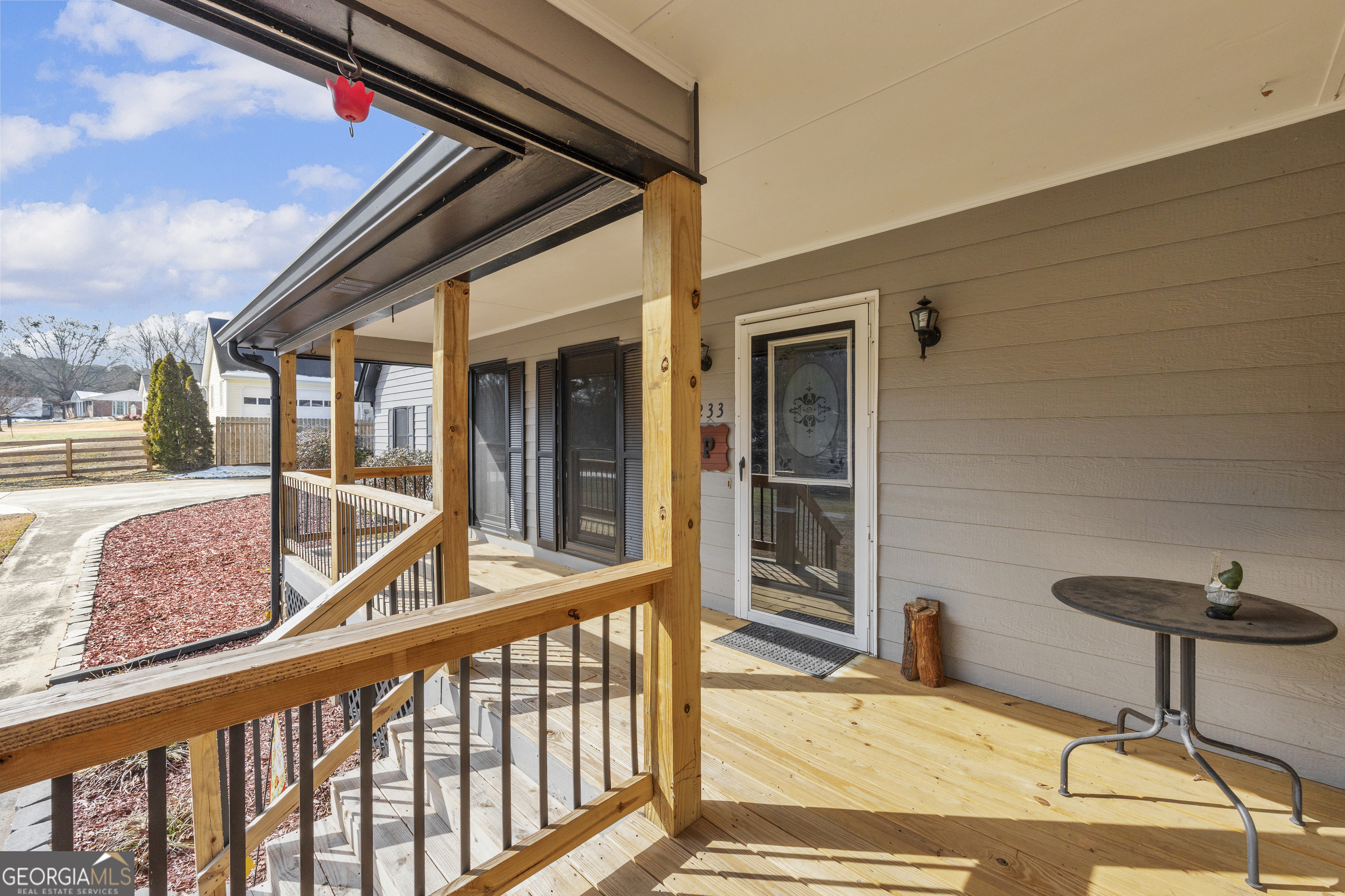 233 Kennedy Sells Road Northwest Auburn, GA 30011 - Photo 8 of 52 a view of a balcony with furniture