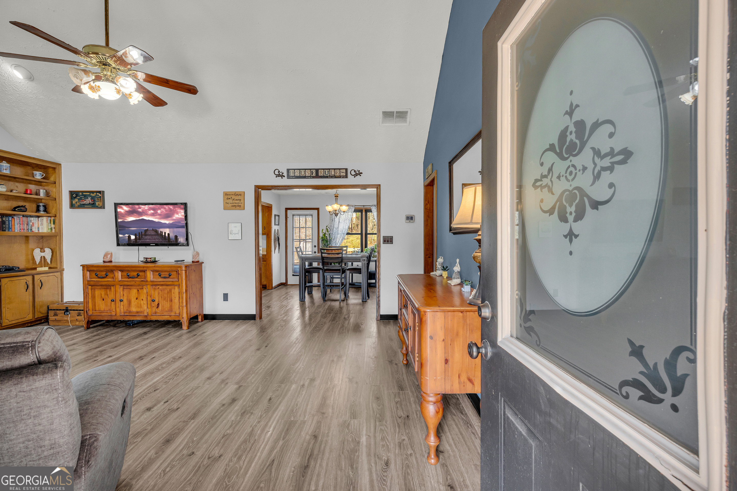 233 Kennedy Sells Road Northwest Auburn, GA 30011 - Photo 10 of 52 a living room with furniture and a flat screen tv