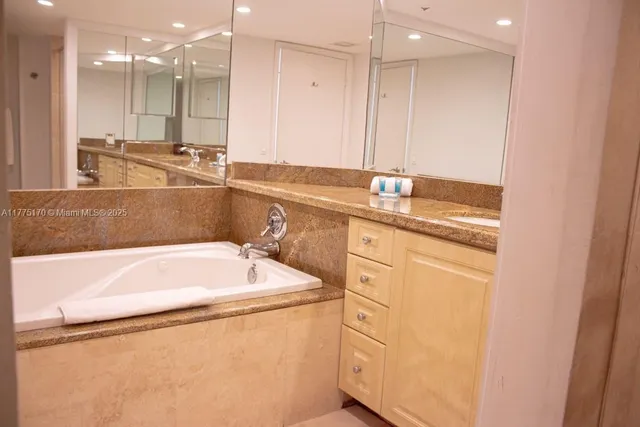 a bathroom with a bathtub and a sink