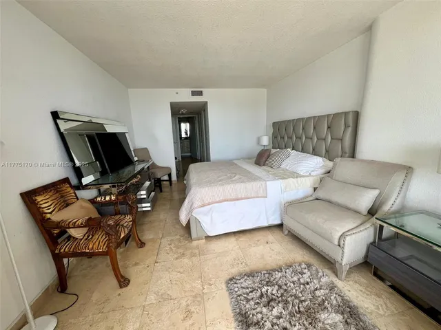 a bedroom with furniture and a couch