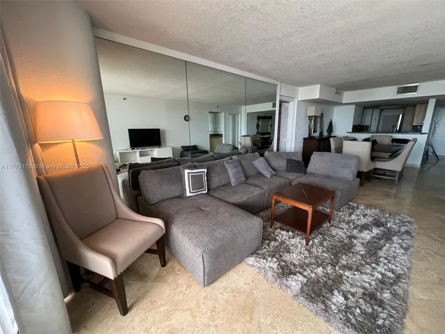 a bathroom with a toilet a sink and a shower