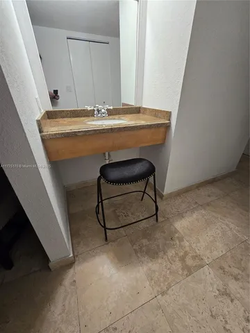 a bathroom with a toilet a sink and shower