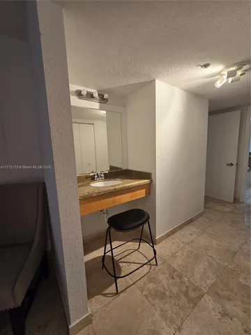 a bedroom with a bed and a television in it